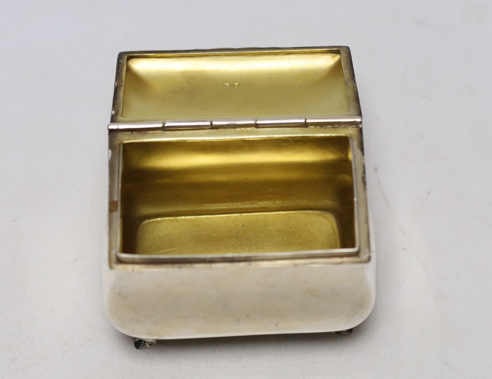 A George V silver bombe shaped tea caddy, S.W. Smith & Co, Birmingham, 1916, width 9cm, together with a later silver caddy spoon.